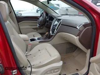 2016 Cadillac SRX Premium Collection z VIN 3GYFNDE37GS525186, wystawiony jako IAAI lot #42179497 z przebiegiem 117 200 mil mil oraz . Historia ofert i sprzedaży dostępna na DreamBid. Obrazek 5.