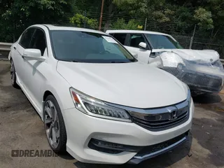 2017 Honda Accord Touring with VIN 1HGCR3F94HA019801, listed as a IAAI auction lot 42399508 with 101,051 mi miles and . Bid and sale history available at DreamBid. Image 1.