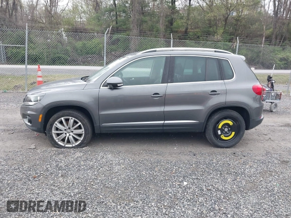2013 Volkswagen Tiguan SE with VIN WVGAV7AX9DW547633, listed as a IAAI auction lot 42009704 with 51,826 mi miles and . Bid and sale history available at DreamBid. Image 14.