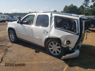 2013 GMC Yukon Denali with VIN 1GKS2EEF9DR311929, listed as a Copart auction lot 63810874 with 122,356 mi miles and Salvage Title. Bid and sale history available at carsss.com. Image 2.