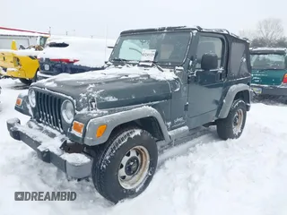2004 Jeep Wrangler SE with VIN 1J4FA29154P778915, listed as a IAAI auction lot 41245325 with 205,852 mi miles and . Bid and sale history available at DreamBid. Image 2.