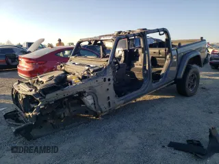 2021 Jeep Gladiator Rubicon с VIN 1C6JJTBMXML503128, выставлен на аукционе Copart как лот 42813725 с пробегом Не указан миль и Списание • Salvage title. История ставок и продаж доступна на DreamBid. Изображение 1.
