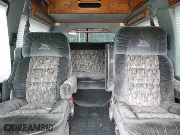 2000 Ford Econoline Cargo Recreational z VIN 1FDRE14L3YHA17676, wystawiony jako Copart lot #58571465 z przebiegiem 174 129 mil mil oraz Szkoda całkowita • Salvage title. Historia ofert i sprzedaży dostępna na DreamBid. Obrazek 10.