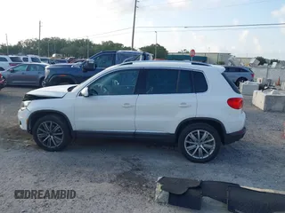 2013 Volkswagen Tiguan SE with VIN WVGAV7AX5DW545202, listed as a IAAI auction lot 42318584 with 91,556 mi miles and . Bid and sale history available at DreamBid. Image 14.