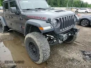 2020 Jeep Gladiator Mojave с VIN 1C6JJTEG4LL206635, выставлен на аукционе Copart как лот 57681805 с пробегом 112 161 миль миль и Списание • Salvage title. История ставок и продаж доступна на DreamBid. Изображение 13.