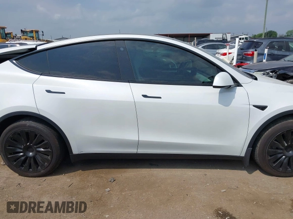 2023 Tesla Model Y Long Range with VIN 7SAYGAEEXPF776370, listed as a IAAI auction lot 42127512 with 27,120 mi miles and . Bid and sale history available at DreamBid. Image 14.
