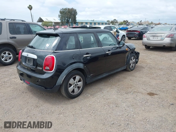 2015 MINI Hardtop 4 Door z VIN WMWXS5C58FT831568, wystawiony jako IAAI lot #42129819 z przebiegiem 76 044 mil mil oraz . Historia ofert i sprzedaży dostępna na DreamBid. Obrazek 4.