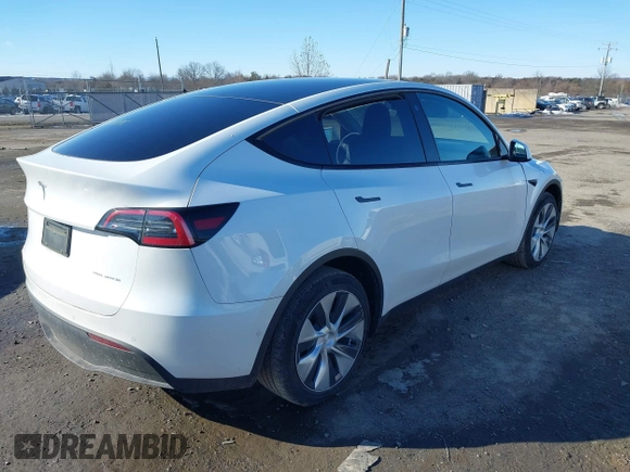 2022 Tesla Model Y Long Range with VIN 7SAYGDEE2NF440548, listed as a IAAI auction lot 41360276 with 19,714 mi miles and . Bid and sale history available at carsss.com. Image 4.