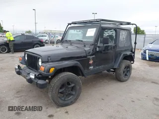 2000 Jeep Wrangler Sahara with VIN 1J4FA59S7YP805628, listed as a IAAI auction lot 42259201 with Not provided miles and . Bid and sale history available at DreamBid. Image 2.
