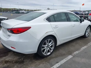 2014 Mazda 6 i Touring with VIN JM1GJ1V59E1109421, listed as a IAAI auction lot 42094480 with 153,287 mi miles. Bid and sale history available at carsss.com. Image 4.