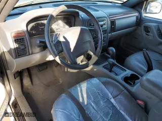 1999 Jeep Grand Cherokee Laredo with VIN 1J4GW58NXXC776438, listed as a Copart auction lot 84412044 with 163,060 mi miles and Salvage Title. Bid and sale history available at carsss.com. Image 8.