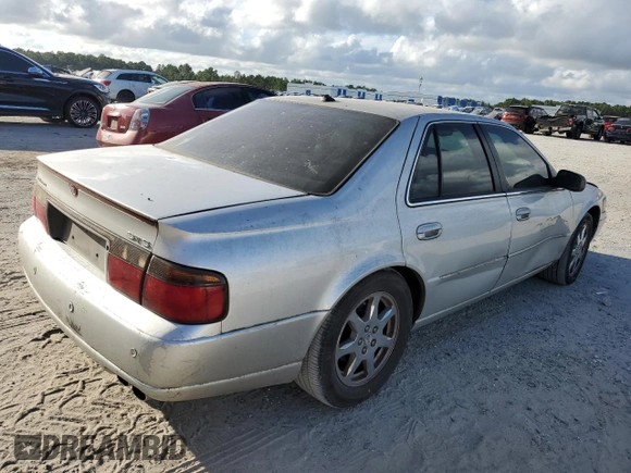 2003 Cadillac Seville Touring STS z VIN 1G6KY54923U101998, wystawiony jako Copart lot #74029304 z przebiegiem 134 157 mil mil oraz Szkoda całkowita • Salvage title. Historia ofert i sprzedaży dostępna na DreamBid. Obrazek 3.