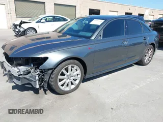 2014 Audi A6 3.0T Prestige with VIN WAUHGAFC9EN028196, listed as a IAAI auction lot 41993806 with 100,215 mi miles. Bid and sale history available at carsss.com. Image 2.