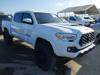 2021 Toyota Tacoma 4WD SR with VIN 3TMCZ5AN7MM390091, listed as a IAAI auction lot 41937894 with 56,689 mi miles. Bid and sale history available at carsss.com. Image 1.