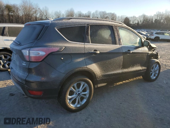 2018 Ford Escape SE z VIN 1FMCU9GD7JUA19262, wystawiony jako Copart lot #84627944 z przebiegiem 89 993 mil mil oraz Szkoda całkowita • Salvage title. Historia ofert i sprzedaży dostępna na DreamBid. Obrazek 3.