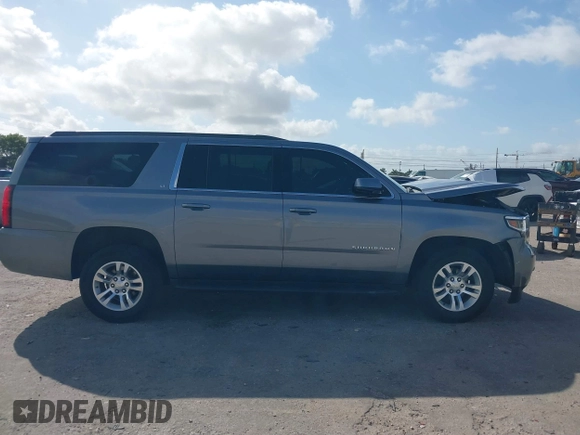 2020 Chevrolet Suburban LT z VIN 1GNSCHKC8LR157188, wystawiony jako IAAI lot #41578614 z przebiegiem 82 566 mil mil oraz . Historia ofert i sprzedaży dostępna na DreamBid. Obrazek 13.