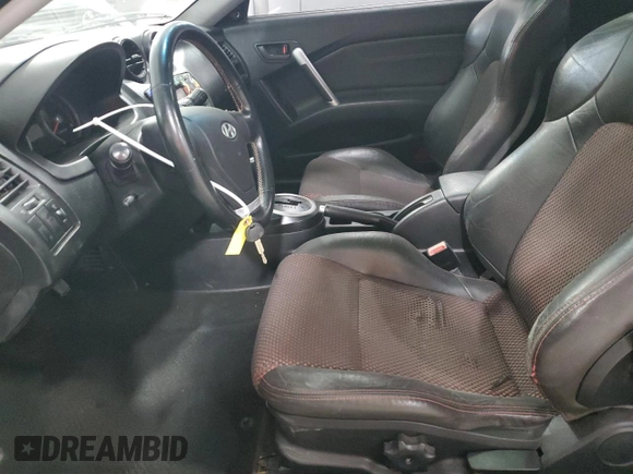 2006 Hyundai Tiburon GT z VIN KMHHN65F96U203924, wystawiony jako Copart lot #43624185 z przebiegiem 120 403 mil mil oraz Szkoda całkowita • Salvage title. Historia ofert i sprzedaży dostępna na DreamBid. Obrazek 7.