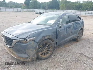 2021 Mazda CX-9 Grand Touring with VIN JM3TCADY2M0509286, listed as a IAAI auction lot 39976279 with 93,588 mi miles and . Bid and sale history available at DreamBid. Image 2.