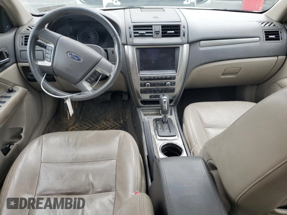 2010 Ford Fusion Hybrid with VIN 3FADP0L36AR203663, listed as a Copart auction lot 60310095 with 211,922 mi miles and Salvage title. Bid and sale history available at DreamBid. Image 8.