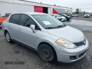 2007 Nissan Versa 1.8 SL with VIN 3N1BC11E97L447829, listed as a IAAI auction lot 41612386 with 123,500 mi miles. Bid and sale history available at carsss.com. Image 6.