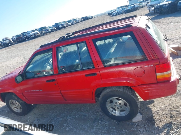 1998 Jeep Grand Cherokee Laredo with VIN 1J4GZ48Y6WC290798, listed as a IAAI auction lot 41816161 with 299,875 mi miles. Bid and sale history available at carsss.com. Image 14.
