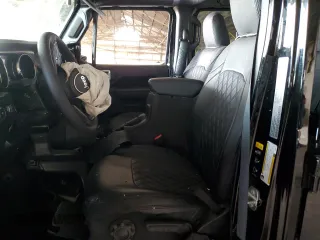 2023 Jeep Wrangler Sport S with VIN 1C4HJXDG0PW668162, listed as a Copart auction lot 45942865 with 62,944 mi miles and Salvage Title. Bid and sale history available at DreamBid. Image 7.