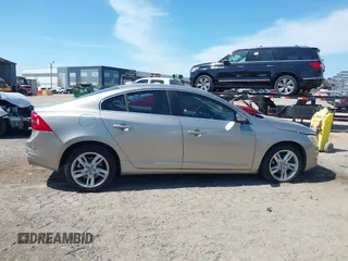 2015 Volvo S60 T5 Drive-E Premier Plus with VIN YV140MFC9F1318920, listed as a IAAI auction lot 41930684 with 66,790 mi miles. Bid and sale history available at carsss.com. Image 13.