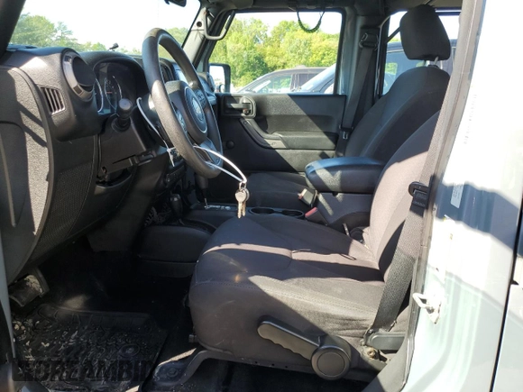 2015 Jeep Wrangler Unlimited Willys Wheeler with VIN 1C4BJWDG5FL609110, listed as a Copart auction lot 56013255 with 153,202 mi miles and Clean Title. Bid and sale history available at DreamBid. Image 7.