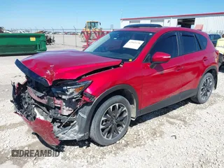 2016 Mazda CX-5 Grand Touring with VIN JM3KE2DYXG0652017, listed as a IAAI auction lot 42041158 with 95,946 mi miles and . Bid and sale history available at DreamBid. Image 2.