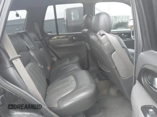 2002 GMC Envoy SLT with VIN 1GKDT13S222143135, listed as a IAAI auction lot 42136672 with 206,064 mi miles. Bid and sale history available at carsss.com. Image 8.
