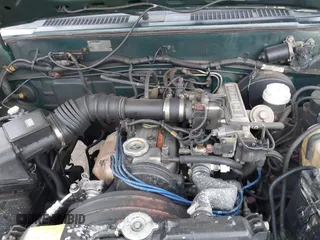 1992 Mitsubishi Mighty Max z VIN JA7FL24W5NP011633, wystawiony jako IAAI lot #41864873 z przebiegiem 301 895 mil mil oraz . Historia ofert i sprzedaży dostępna na DreamBid. Obrazek 10.