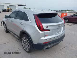 2019 Cadillac XT4 FWD Premium Luxury z VIN 1GYFZCR42KF189610, wystawiony jako IAAI lot #42137690 z przebiegiem 92 502 mil mil oraz . Historia ofert i sprzedaży dostępna na DreamBid. Obrazek 3.