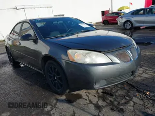 2006 Pontiac G6 6-Cyl with VIN 1G2ZG558264119494, listed as a IAAI auction lot 40977267 with 180,404 mi miles. Bid and sale history available at carsss.com. Image 1.