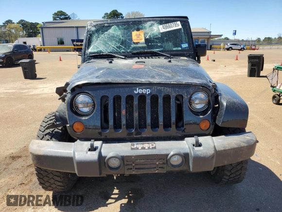 2007 Jeep Wrangler Sahara z VIN 1J4FA54177L183617, wystawiony jako Copart lot #49660785 z przebiegiem 178 846 mil mil oraz Szkoda całkowita • Salvage title. Historia ofert i sprzedaży dostępna na DreamBid. Obrazek 5.
