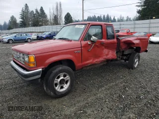 1990 Ford Ranger XLT with VIN 1FTCR15X6LPB44730, listed as a Copart auction lot 87076334 with 91,204 mi miles and Salvage Title. Bid and sale history available at DreamBid. Image 1.