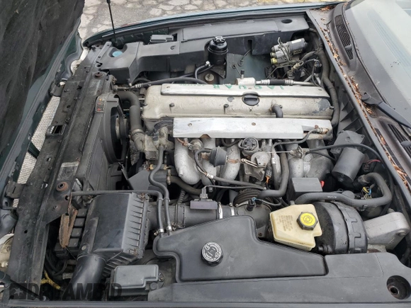 1996 Jaguar XJ with VIN SAJHX1741TC758740, listed as a Copart auction lot 73377914 with 140,964 mi miles and Salvage title. Bid and sale history available at DreamBid. Image 12.