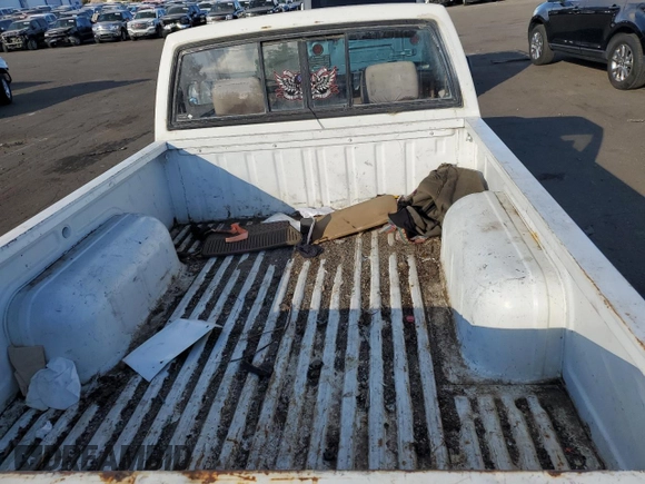 1987 Nissan Hardbody E z VIN JN6ND11S4HW011430, wystawiony jako Copart lot #81785214 z przebiegiem 334 566 mil mil oraz Tytuł czysty. Historia ofert i sprzedaży dostępna na DreamBid. Obrazek 10.