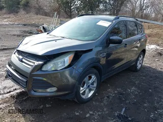 2016 Ford Escape SE with VIN 1FMCU0GX1GUC19942, listed as a IAAI auction lot 41504587 with 142,122 mi miles. Bid and sale history available at carsss.com. Image 2.