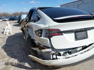 2023 Tesla Model X Plaid with VIN 7SAXCBE63PF405105, listed as a IAAI auction lot 41876918 with 22,475 mi miles and . Bid and sale history available at DreamBid. Image 3.