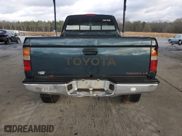 1996 Toyota Tacoma with VIN 4TAWM72N4TZ103661, listed as a Copart auction lot 86506054 with 197,518 mi miles and Salvage title. Bid and sale history available at DreamBid. Image 6.