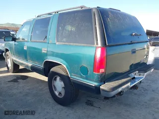 1997 Chevrolet Tahoe with VIN 1GNEK13RXVJ375189, listed as a IAAI auction lot 41959601 with 153,589 mi miles. Bid and sale history available at carsss.com. Image 3.