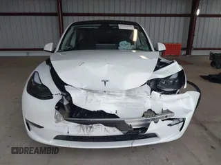 2023 Tesla Model Y Long Range z VIN 7SAYGDEE2PF834036, wystawiony jako IAAI lot #41933120 z przebiegiem 27 872 mil mil oraz . Historia ofert i sprzedaży dostępna na DreamBid. Obrazek 13.