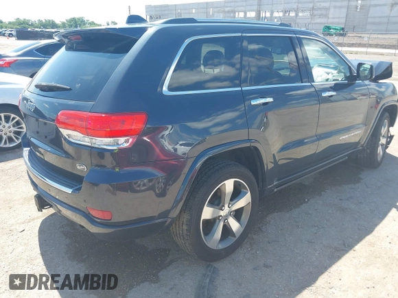 2015 Jeep Grand Cherokee High Altitude with VIN 1C4RJFCG5FC807394, listed as a IAAI auction lot 42452034 with 72,011 mi miles and . Bid and sale history available at DreamBid. Image 4.