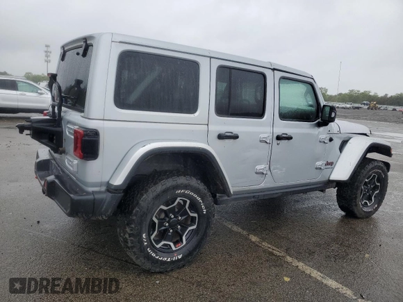 2023 Jeep Wrangler Rubicon with VIN 1C4JJXFM4PW589923, listed as a Copart auction lot 58725465 with 9,814 mi miles and Salvage title. Bid and sale history available at DreamBid. Image 3.