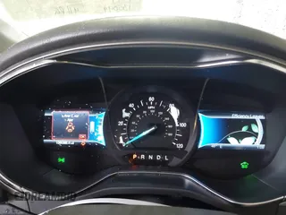 2013 Ford Fusion SE Hybrid with VIN 3FA6P0LU2DR319335, listed as a IAAI auction lot 42007573 with 135,099 mi miles. Bid and sale history available at carsss.com. Image 7.