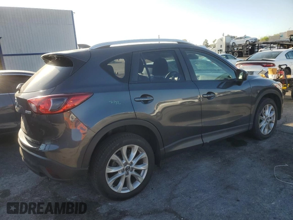 2014 Mazda CX-5 Grand Touring with VIN JM3KE4DY1E0328852, listed as a Copart auction lot 53965265 with 67,242 mi miles and Salvage Title. Bid and sale history available at DreamBid. Image 3.