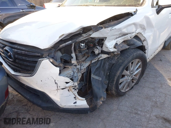 2016 Mazda CX-5 Touring z VIN JM3KE2CY9G0807688, wystawiony jako IAAI lot #41039438 z przebiegiem 169 483 mil mil oraz . Historia ofert i sprzedaży dostępna na DreamBid. Obrazek 6.