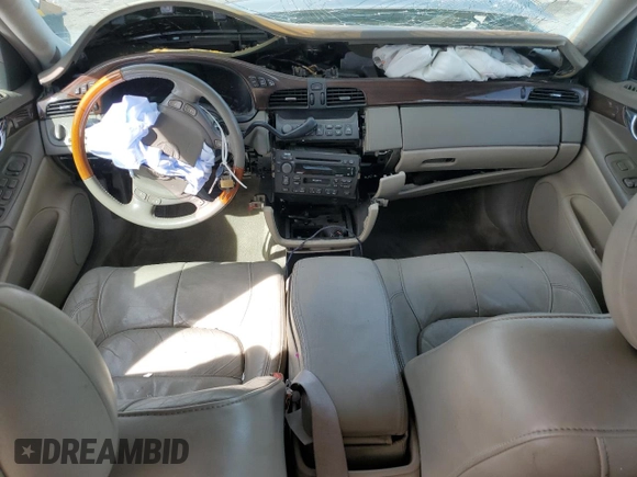 2002 Cadillac DeVille DHS z VIN 1G6KE57Y22U291523, wystawiony jako Copart lot #45711095 z przebiegiem 160 364 mil mil oraz Szkoda całkowita • Salvage title. Historia ofert i sprzedaży dostępna na DreamBid. Obrazek 8.