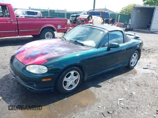 1999 Mazda MX-5 Miata z VIN JM1NB3537X0123440, wystawiony jako IAAI lot #42263294 z przebiegiem 107 356 mil mil oraz . Historia ofert i sprzedaży dostępna na DreamBid. Obrazek 2.
