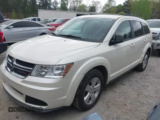 2014 Dodge Journey SE with VIN 3C4PDCABXET135338, listed as a IAAI auction lot 41950088 with 209,944 mi miles. Bid and sale history available at carsss.com. Image 2.